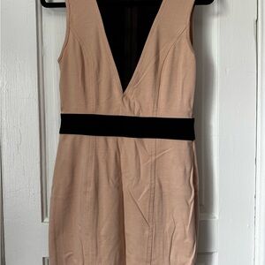 Tan mini dress with sheer plunge neckline and back